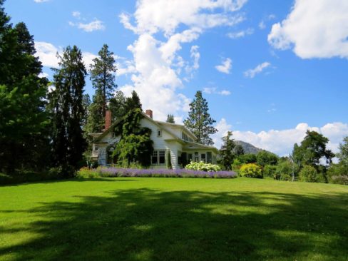 A Country House surrounded by gardens and lawns